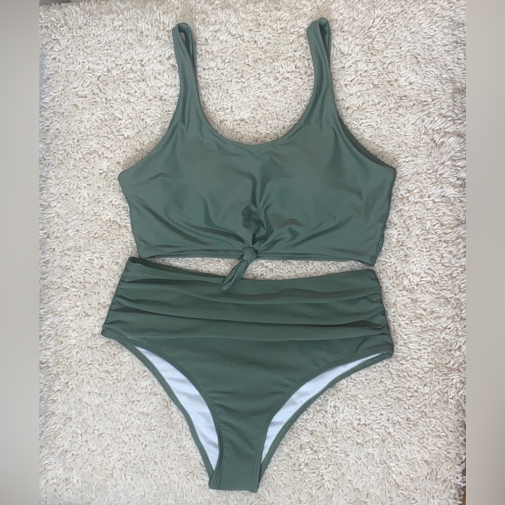 Bikini green in color high waist and has a halter top. Size Large NWT